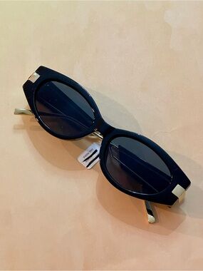 Free People Boho Chic Black Oval Sunglasses with Gold Accents and Black Lenses